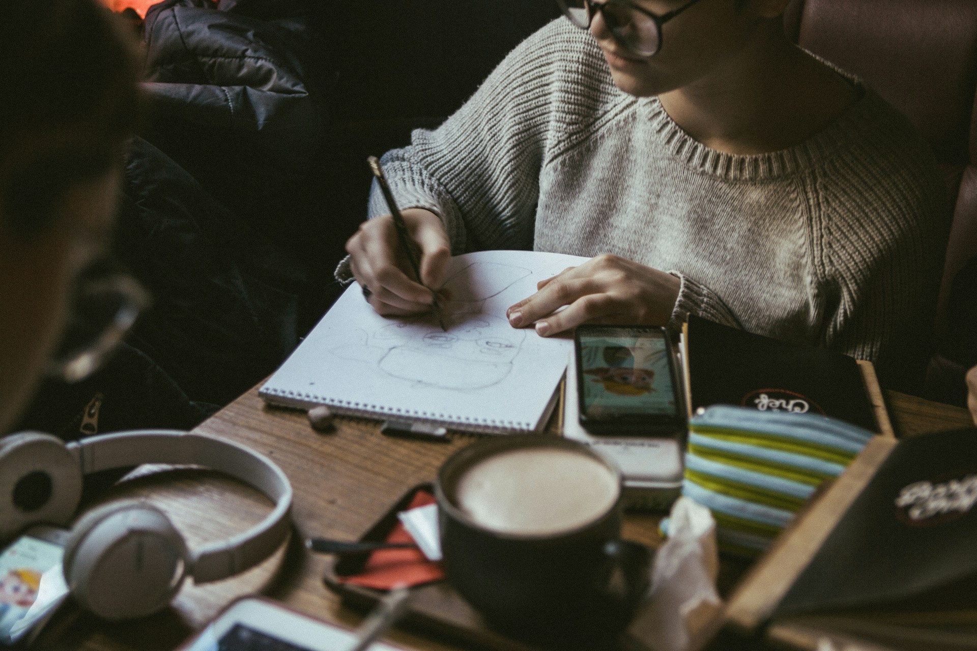Woman sketching on her notes